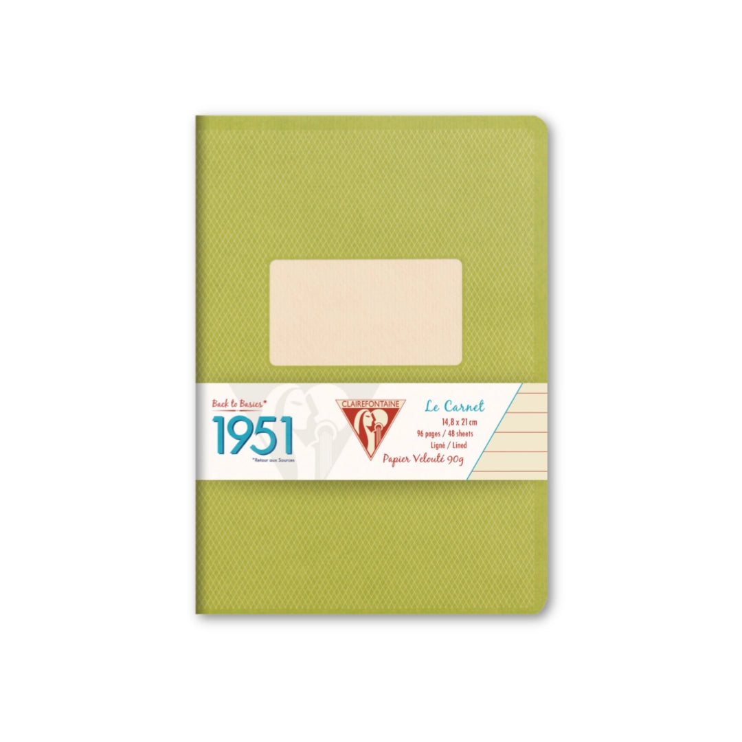 Green notebook with a beige label on a white background
