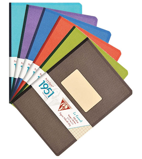Set of colorful notebooks with a visible brand label on a white background