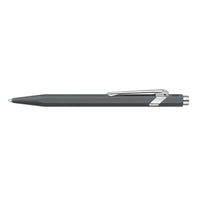 A sleek, dark gray retractable ballpoint pen with polished silver metal accents, including a clip, tip, and end cap, shown horizontally against a solid white background.