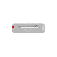 A silver Caran d'Ache pen presented in a slim rectangular silver tin with a Swiss flag emblem, photographed against a solid white background.
