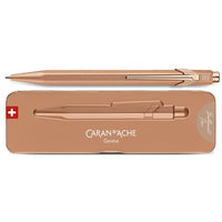 Rose gold pen with Caran d'Ache branding on a white background