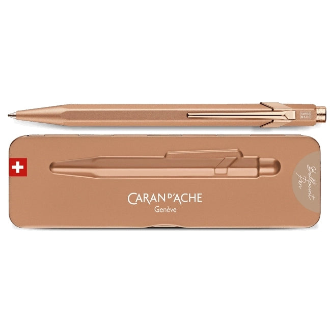 Rose gold pen with Caran d'Ache branding on a white background