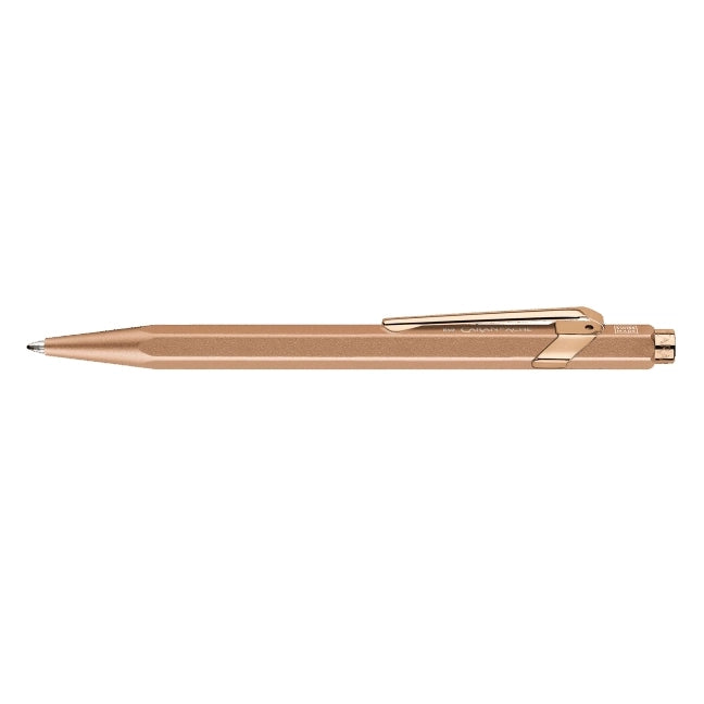 Rose gold pen on a white background