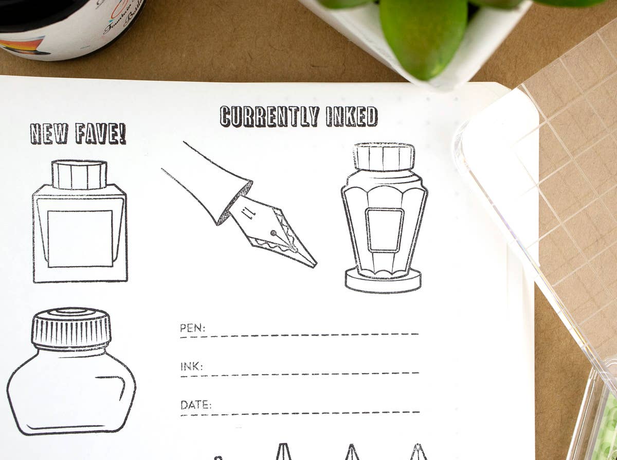 Sheet with ink bottle illustrations and a hand holding a pen, on a brown surface.