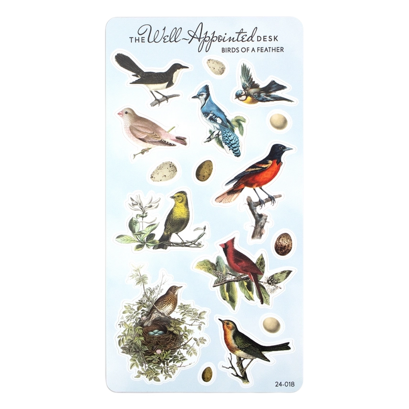 A sheet of decorative stickers from 'The Well-Appointed Desk' featuring various vintage-style bird illustrations, eggs, and branches on a pale blue background.