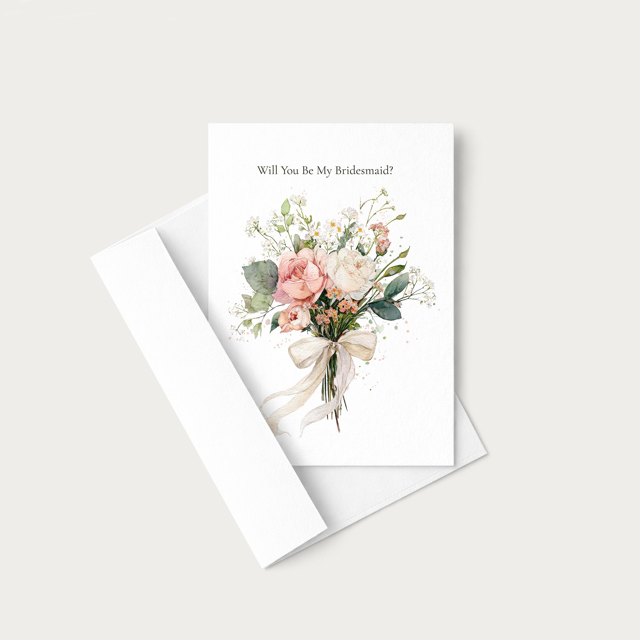 A white greeting card with the text 'Will You Be My Bridesmaid?' above a watercolor bouquet of blush pink, peach, and cream flowers with green leaves, shown with a white envelope on a light warm gray background.