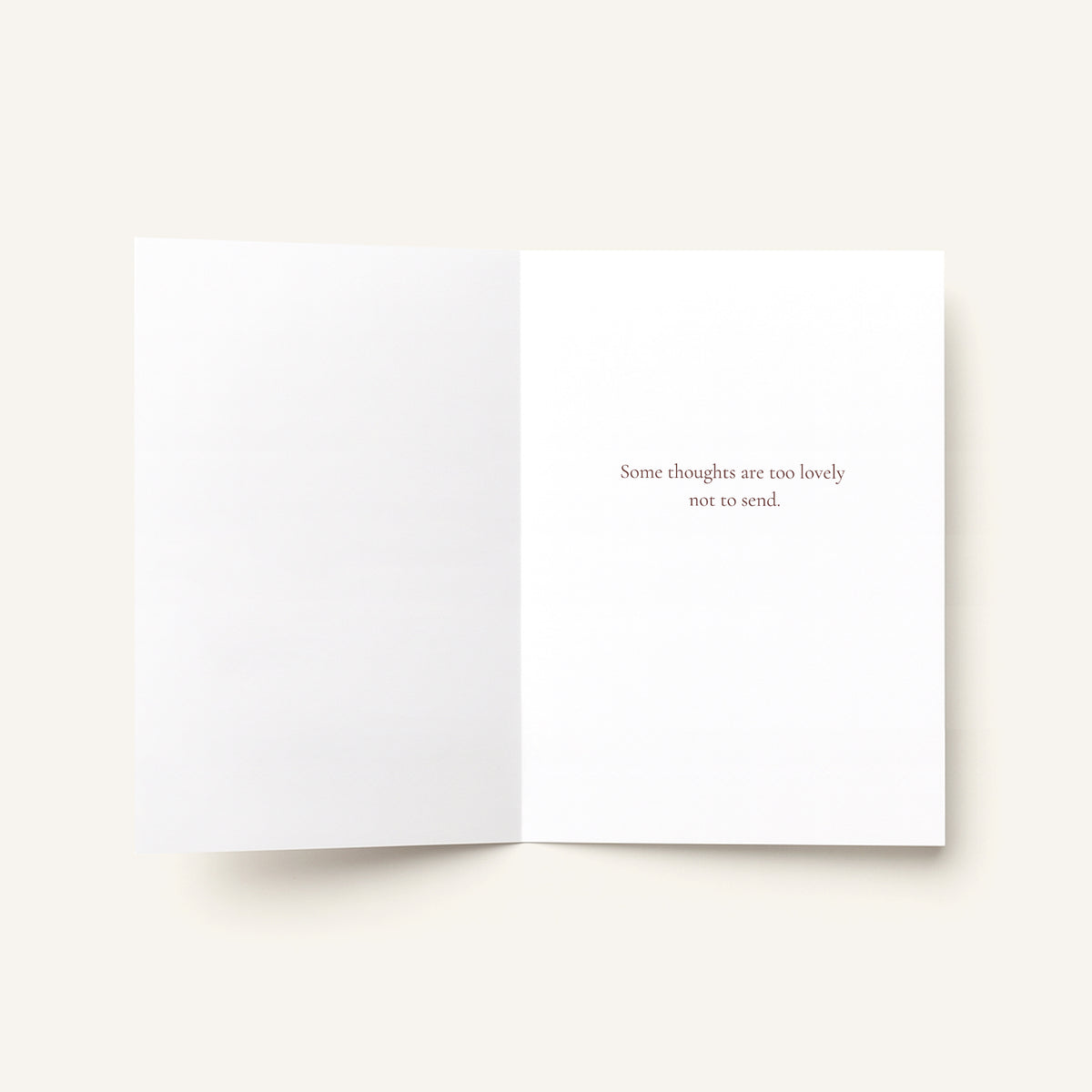 An open white greeting card on a light beige background, with the right page printed with the phrase 'Some thoughts are too lovely not to send.' in a small serif font.