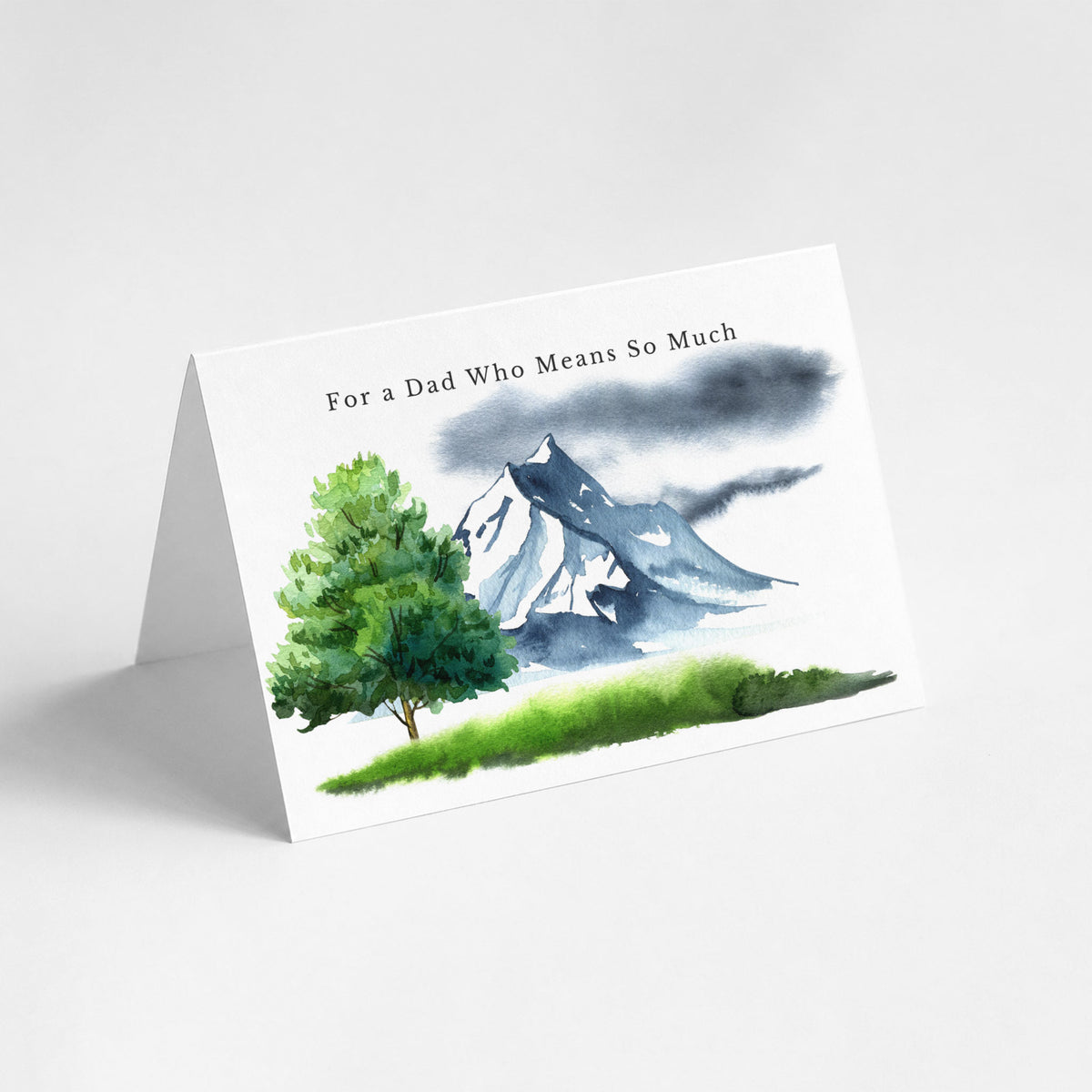 Landscape birthday card for Dad featuring a watercolor mountain scene with an evergreen tree.