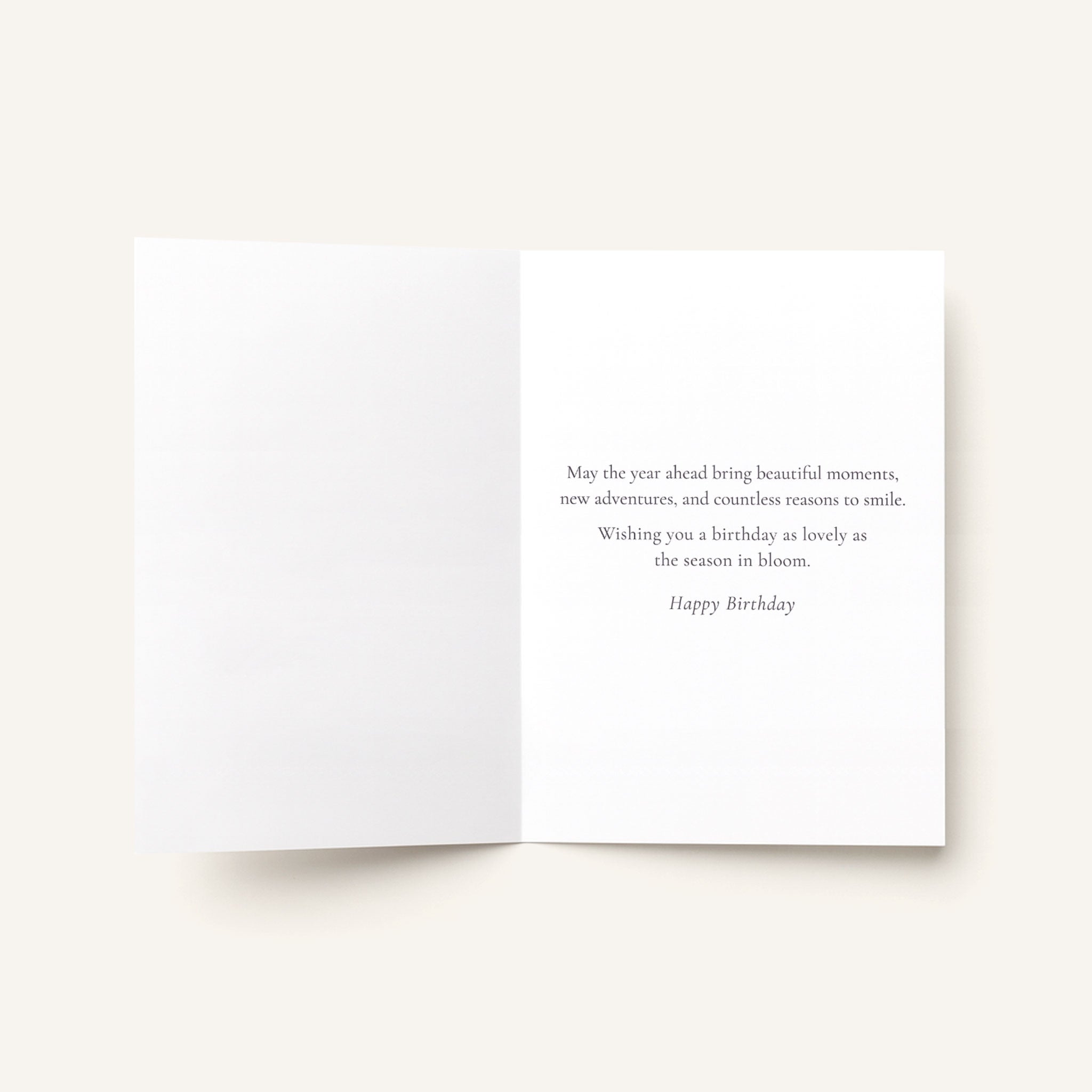 Open Another Year in Bloom card showing the printed birthday message inside.