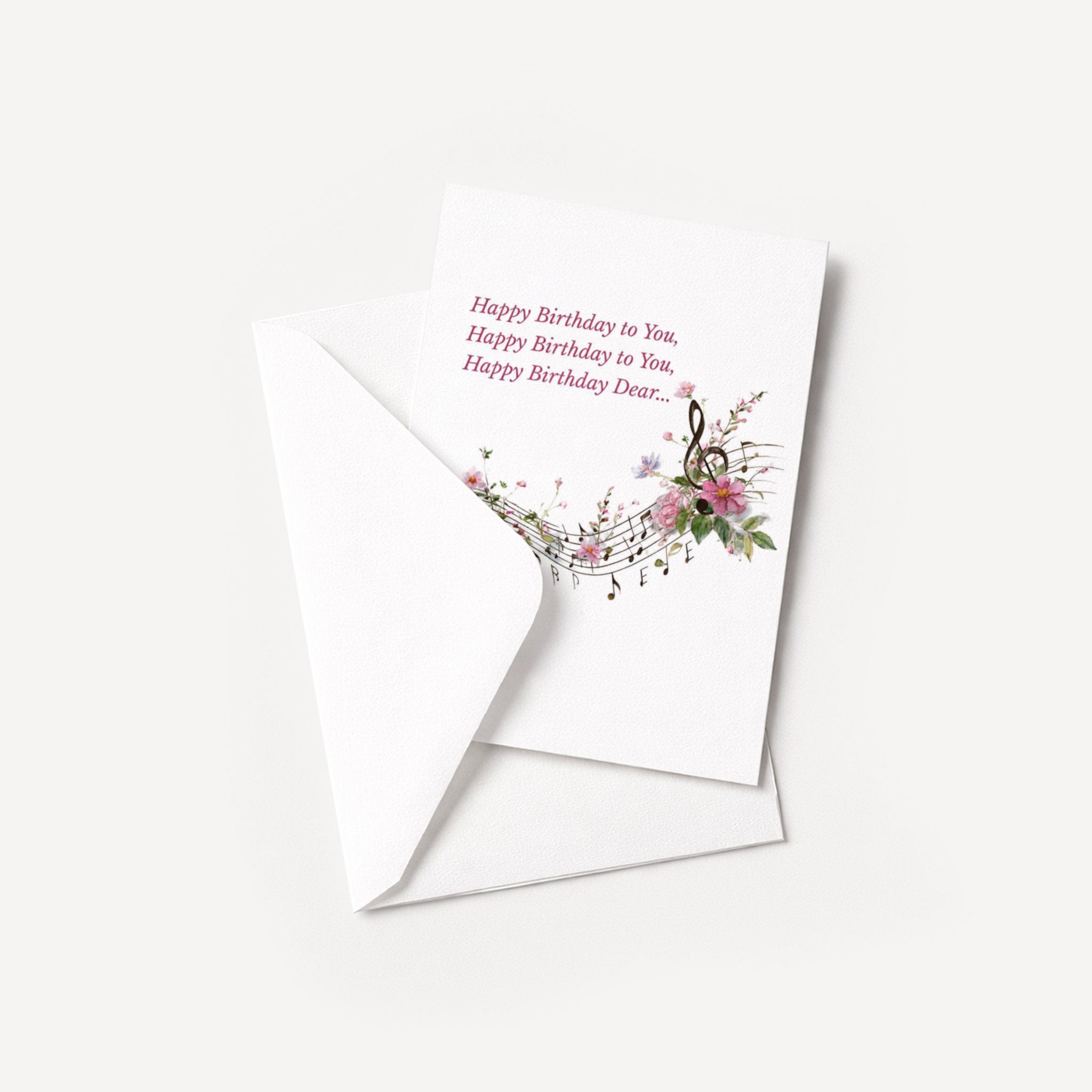 Happy Birthday Dear musical greeting card displayed with a coordinating white pointed-flap envelope.
