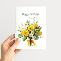Hand holding a birthday card for a dear friend featuring bright yellow watercolor flowers and white daisies.