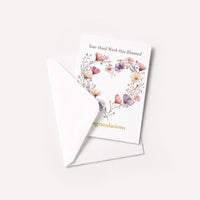 Floral congratulations card displayed with a coordinating white pointed-flap envelope.