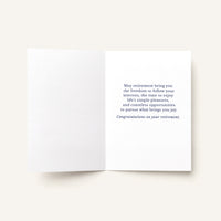 Open retirement card showing the printed message, “May retirement bring you the freedom to follow your interests.”