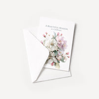 A Beautiful Reason to Celebrate floral card displayed with a coordinating white pointed-flap envelope.
