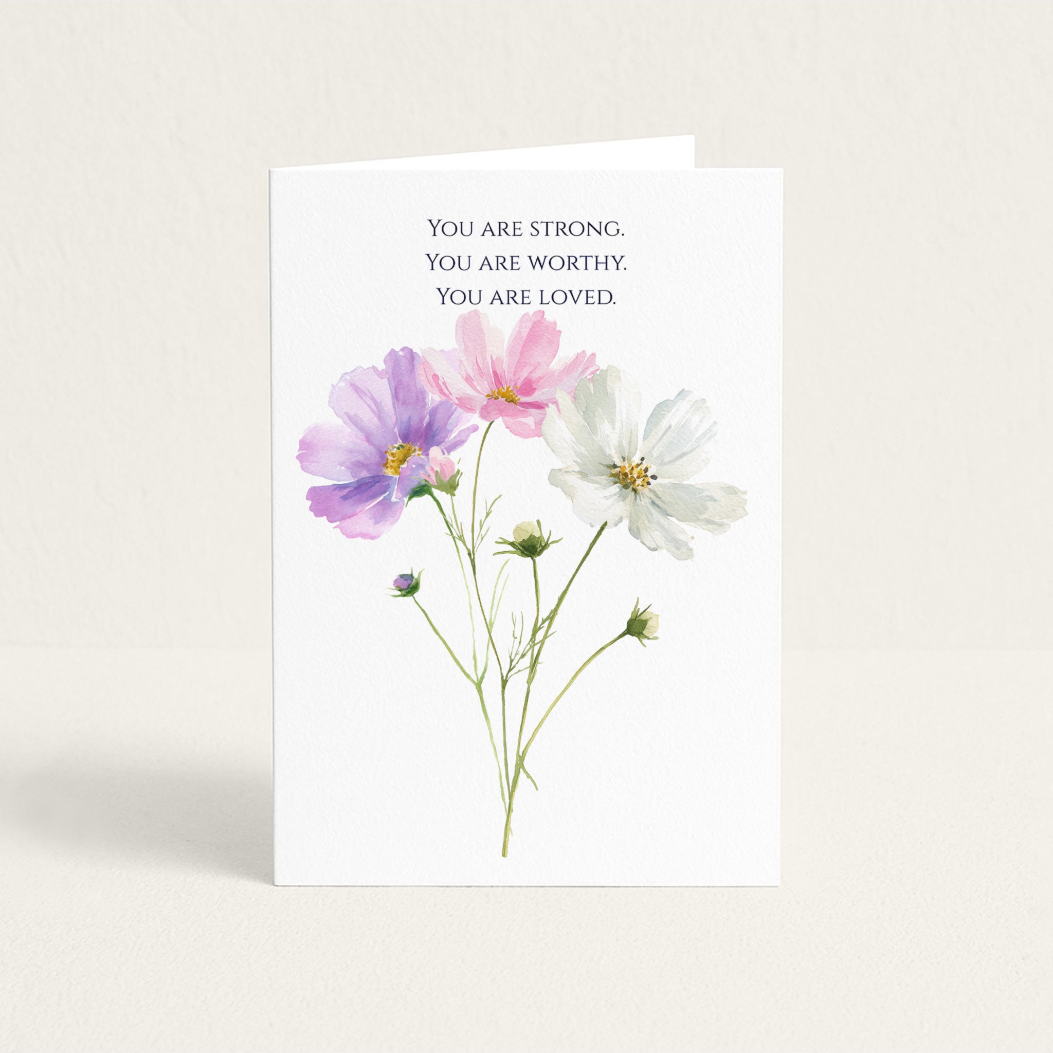 Encouragement card featuring pink, purple, and white watercolor flowers beneath the words “You Are Strong. You Are Worthy. You Are Loved.”
