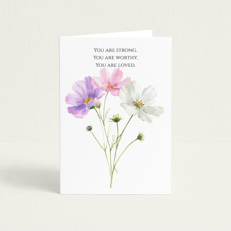 Encouragement card featuring pink, purple, and white watercolor flowers beneath the words “You Are Strong. You Are Worthy. You Are Loved.”
