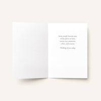 Open friendship card showing the message “Some people become part of the places we love, woven into memories, colors, and seasons. Thinking of you today.”