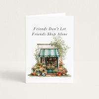Friends Don’t Let Friends Shop Alone friendship card featuring a watercolor flower shop with a green striped awning.
