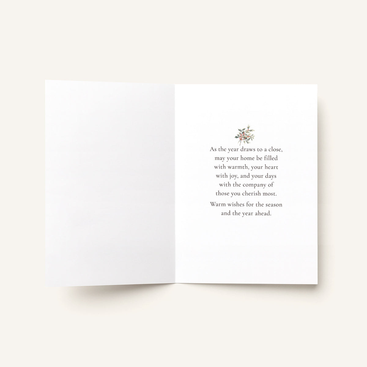 Open seasonal greeting card showing the message “As the year draws to a close, may your home be filled with warmth, your heart with joy, and your days with the company of those you cherish most.”