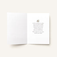 Open seasonal greeting card showing the message “As the year draws to a close, may your home be filled with warmth, your heart with joy, and your days with the company of those you cherish most.”