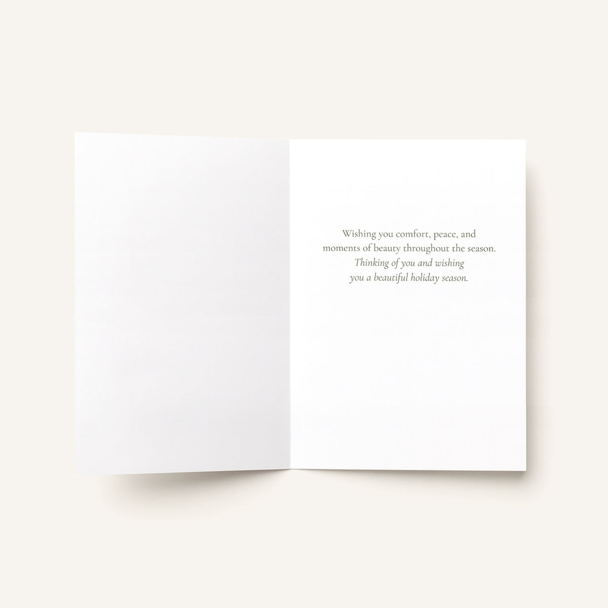 Open holiday thinking-of-you card showing the message “Wishing you comfort, peace, and moments of beauty throughout the season.”