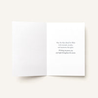 Open Wishing You a Season of Light card showing the printed seasonal message inside.