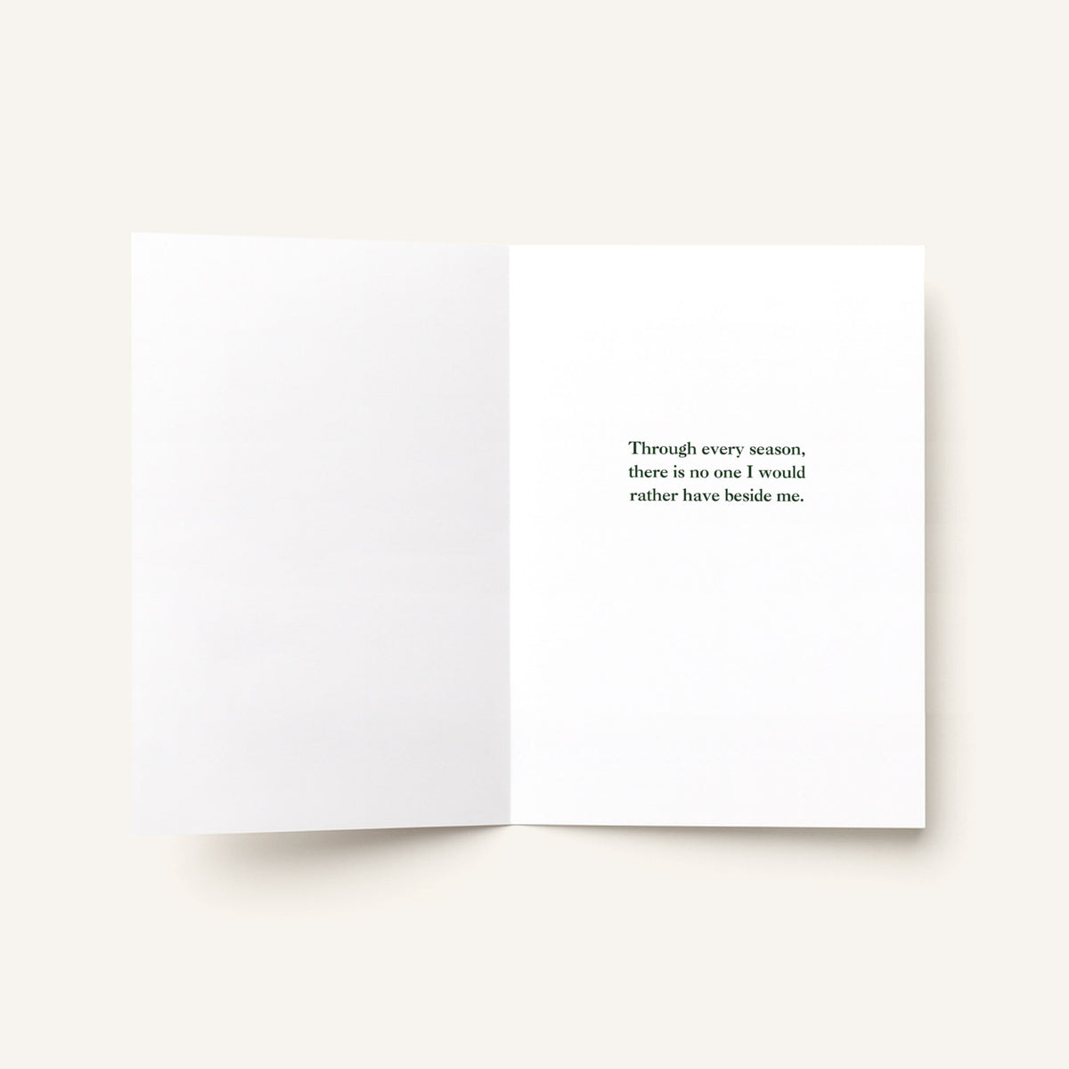 Open love greeting card showing a printed message about sharing every season with someone special.