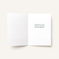 Open love greeting card showing a printed message about sharing every season with someone special.