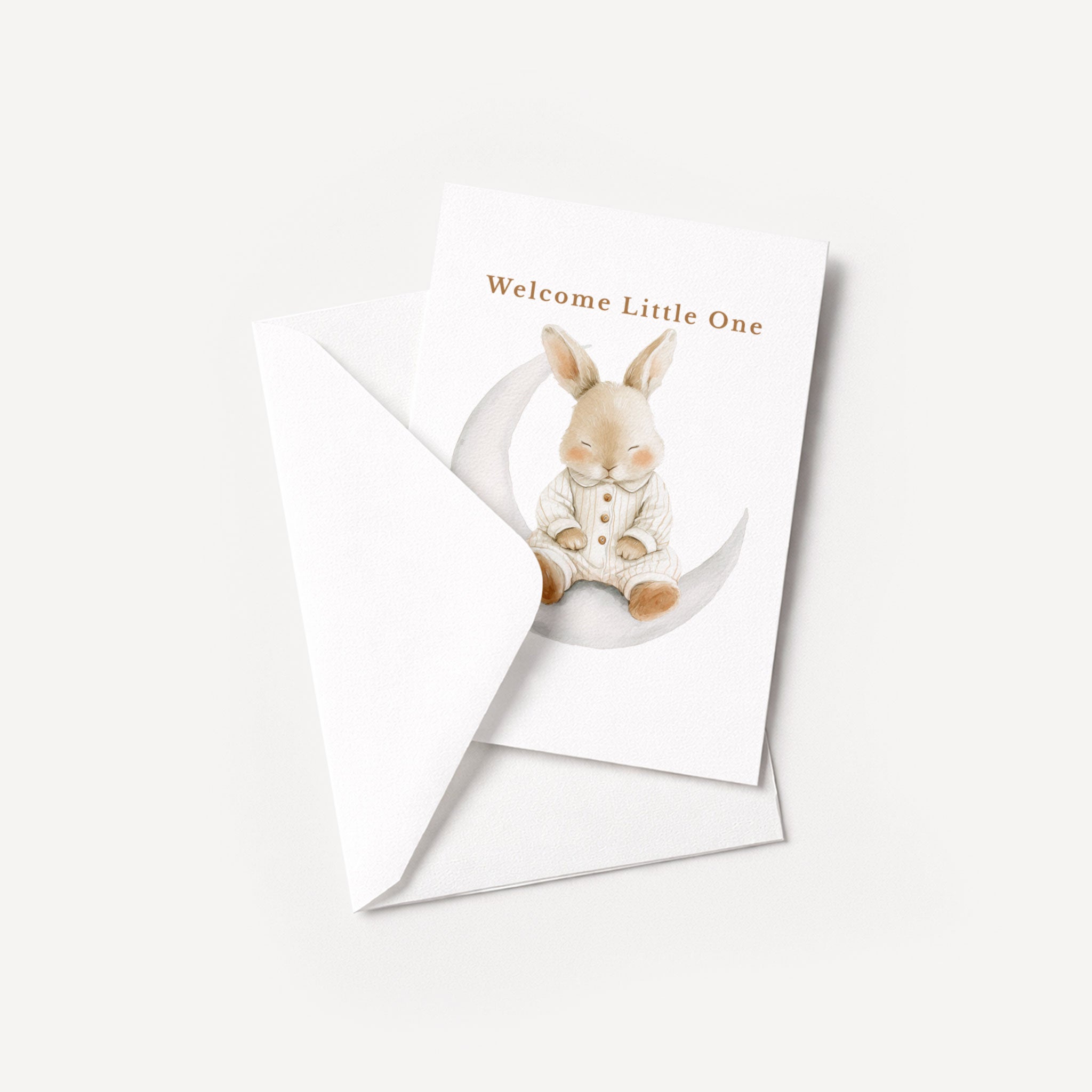 Welcome Little One baby card displayed with a coordinating white pointed-flap envelope.