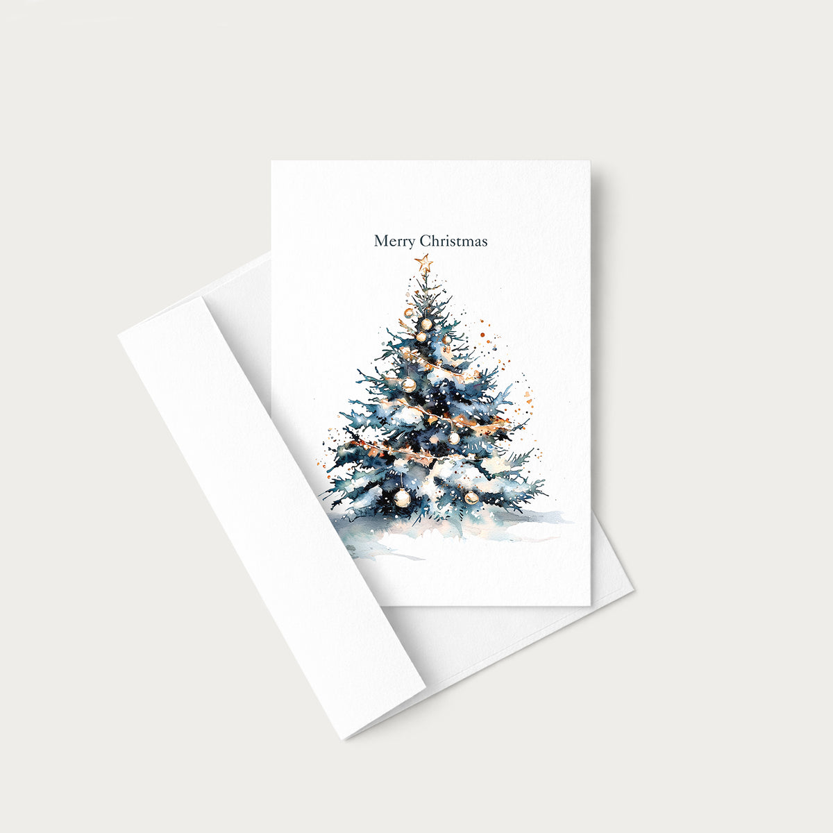 Watercolor Christmas tree greeting card displayed with a coordinating white envelope on a neutral background.