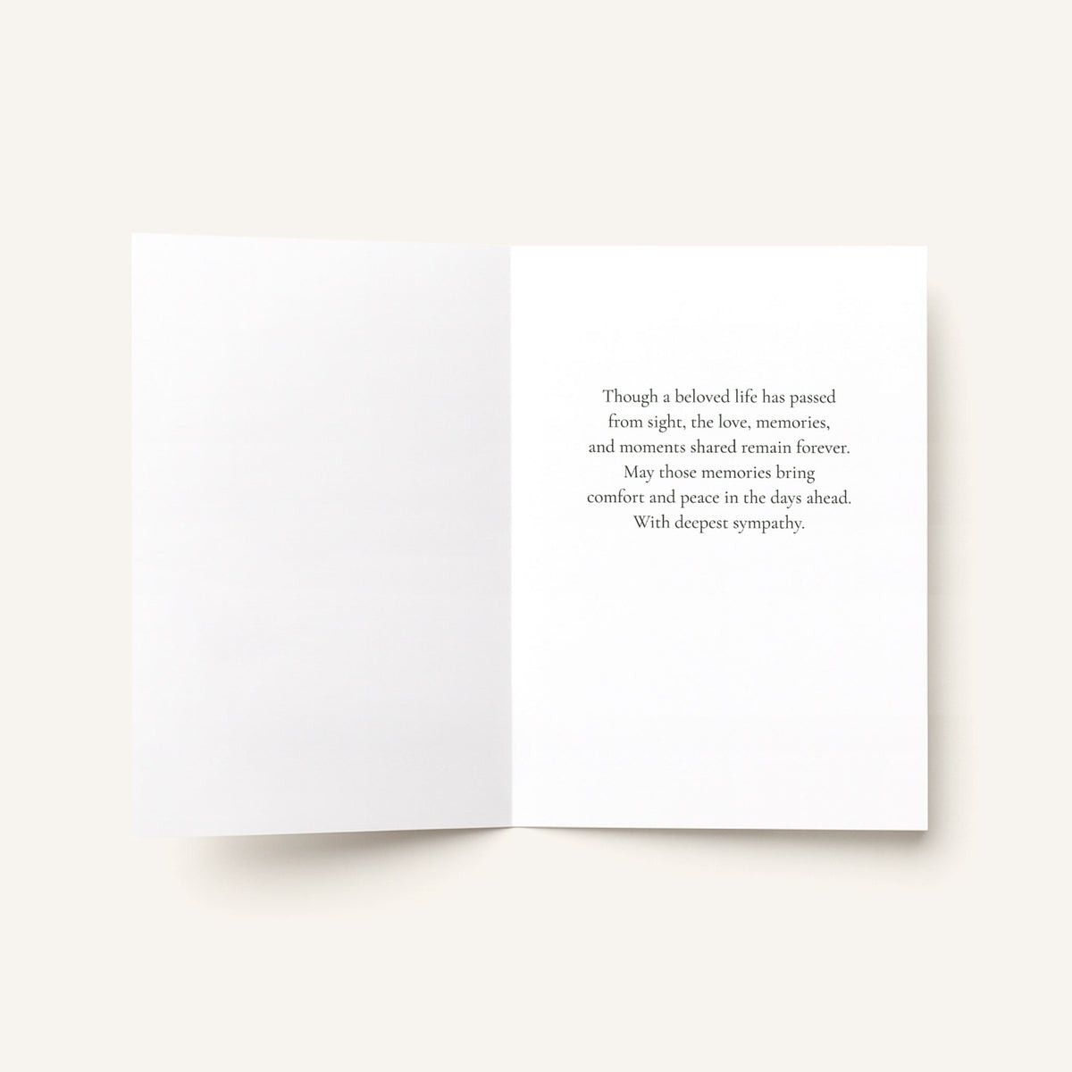 Open sympathy card showing the message “Though a beloved life has passed from sight, the love, memories, and moments shared remain forever.”