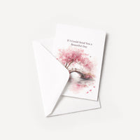 Pink cherry blossom thinking-of-you card displayed with a coordinating white pointed-flap envelope.