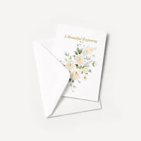 A Beautiful Beginning floral wedding card displayed with a coordinating white pointed-flap envelope.