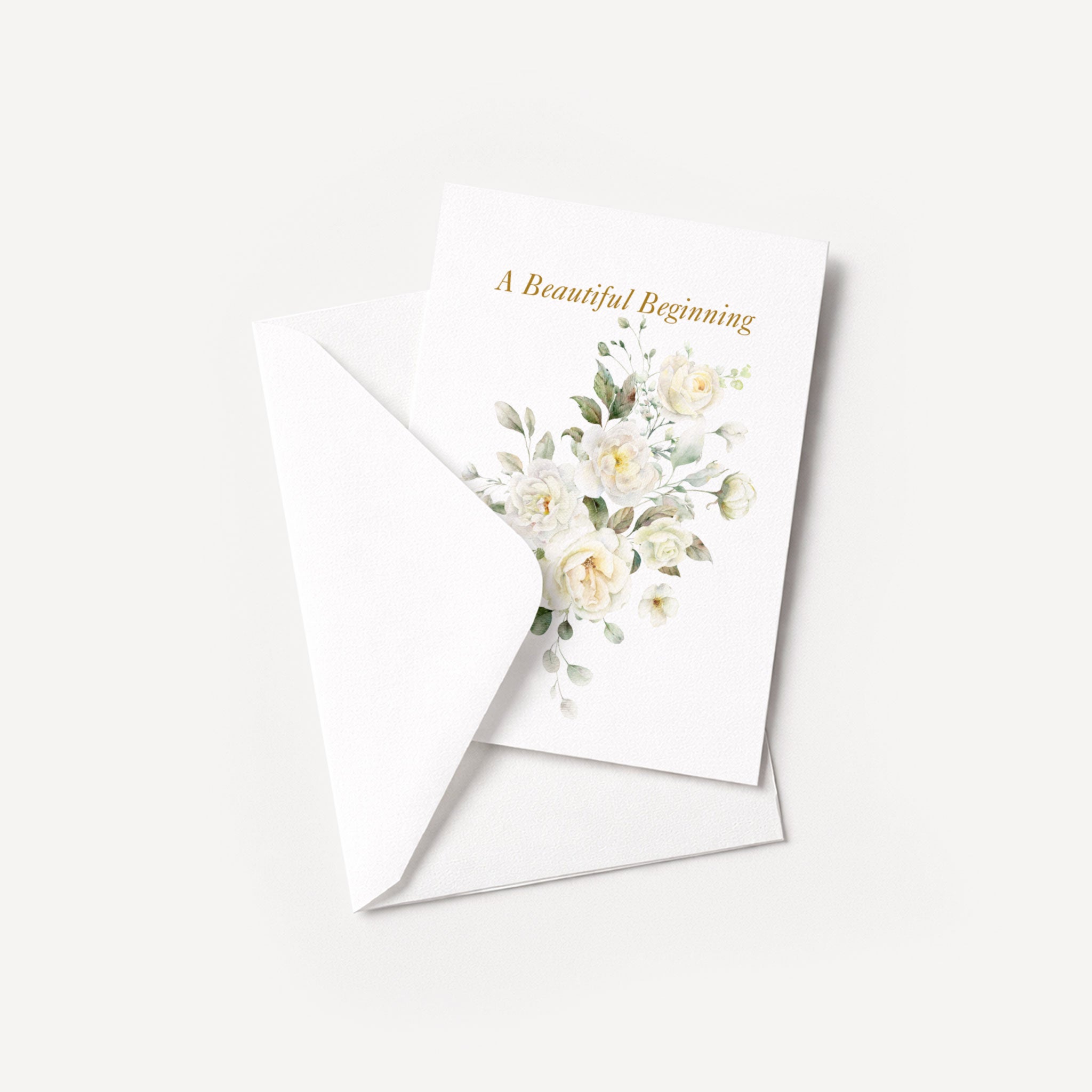 A Beautiful Beginning floral wedding card displayed with a coordinating white pointed-flap envelope.