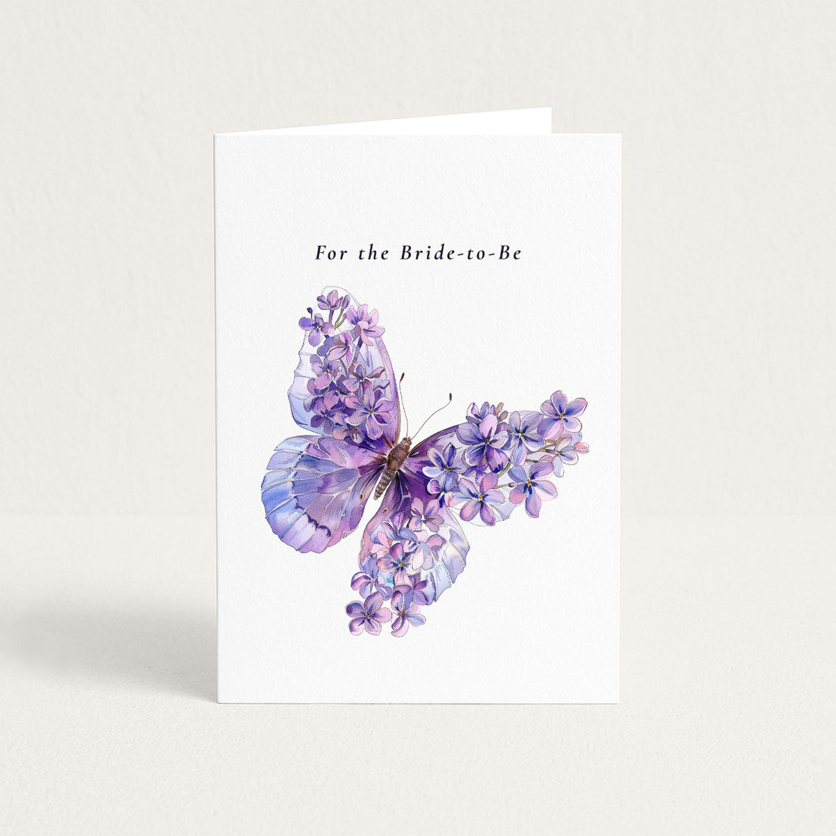 For the Bride-to-Be card featuring a purple watercolor butterfly adorned with delicate lilac blossoms.