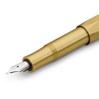 A close-up of a gold-finished fountain pen nib and barrel section on a clean white background.