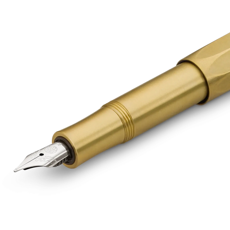 A close-up of a gold-finished fountain pen nib and barrel section on a clean white background.