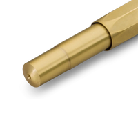 A close-up of a metallic gold pen tip and barrel section on a clean white background.