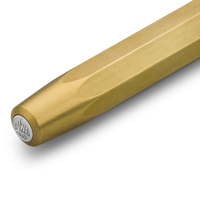 A close-up of a brass-colored metal rod or tube with a circular silver brand badge on one end, shown against a clean white background.