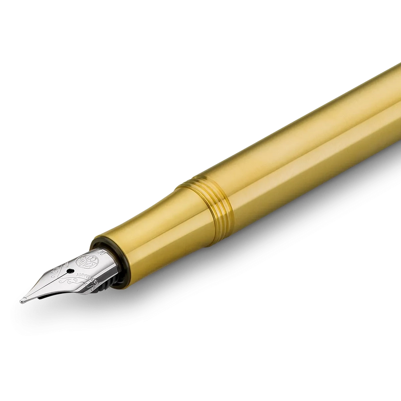 A close-up diagonal view of a gold fountain pen nib and barrel section on a clean white background.