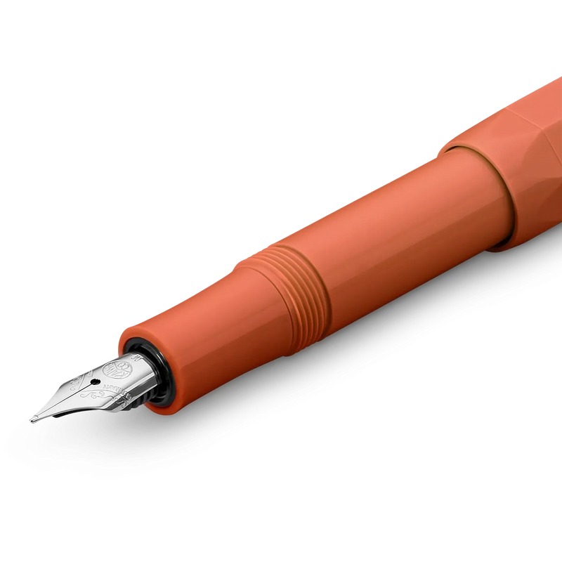 A closeup of an orange fountain pen