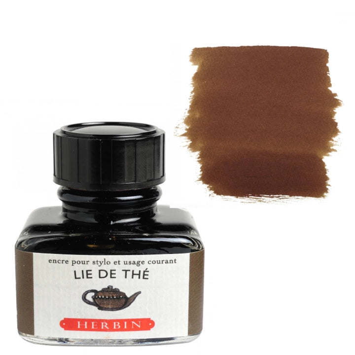 A bottle of Herbin Lie de Thé ink with a black cap and a white label, shown next to a brown ink swatch on a white background.