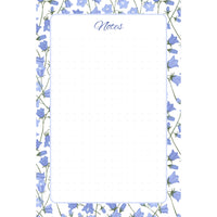 Front view of the Bluebell Garden memo pad with periwinkle-blue bellflowers, pale blue rounded border, and dotted writing field.
