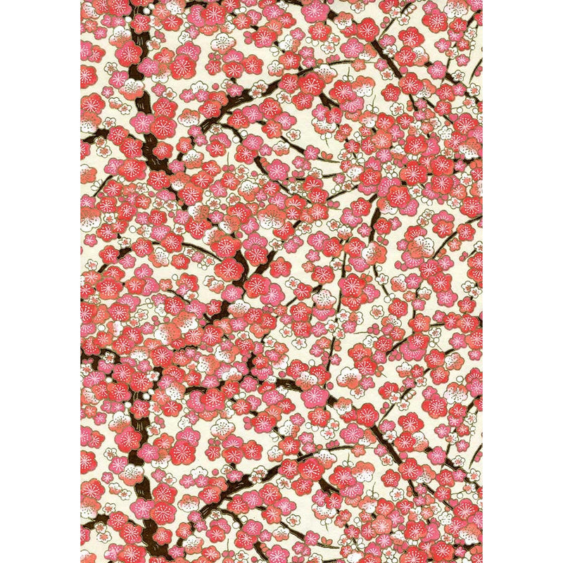 Japanese Chiyogami paper covered with coral, rose, blush, and ivory blossoms on dark branching boughs against a warm cream ground.
