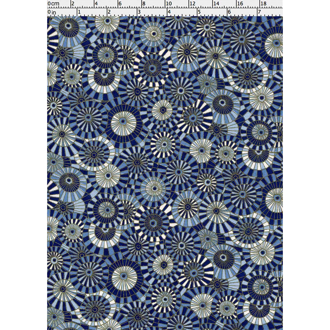 Close-up of hand silk-screen printed Chiyogami paper showing layered Japanese parasols with radiating spokes in indigo, cream, and blue.