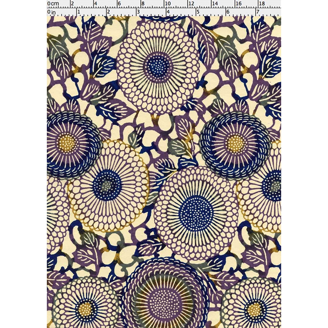 Close-up of hand silk-screen printed Chiyogami paper showing radiating indigo chrysanthemum petals, cream blossoms, and layered botanical details.