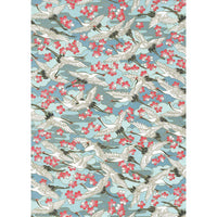 Japanese Chiyogami paper with ivory cranes in flight, coral and white blossoms, and layered blue forms on a turquoise background.