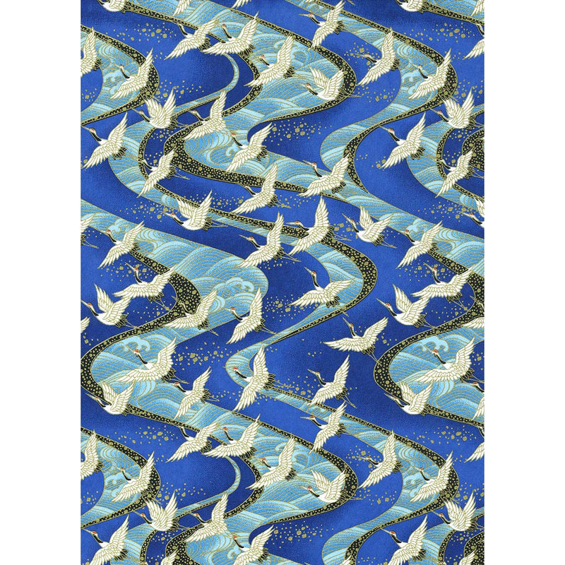 Japanese Chiyogami paper with ivory cranes in flight above sweeping turquoise currents on a cobalt-blue background.