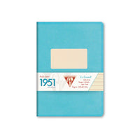 A vintage 1951 French pocket calendar, Le Carret, in a textured turquoise blue cover with a central cream-colored label window and a white paper band around the middle.
