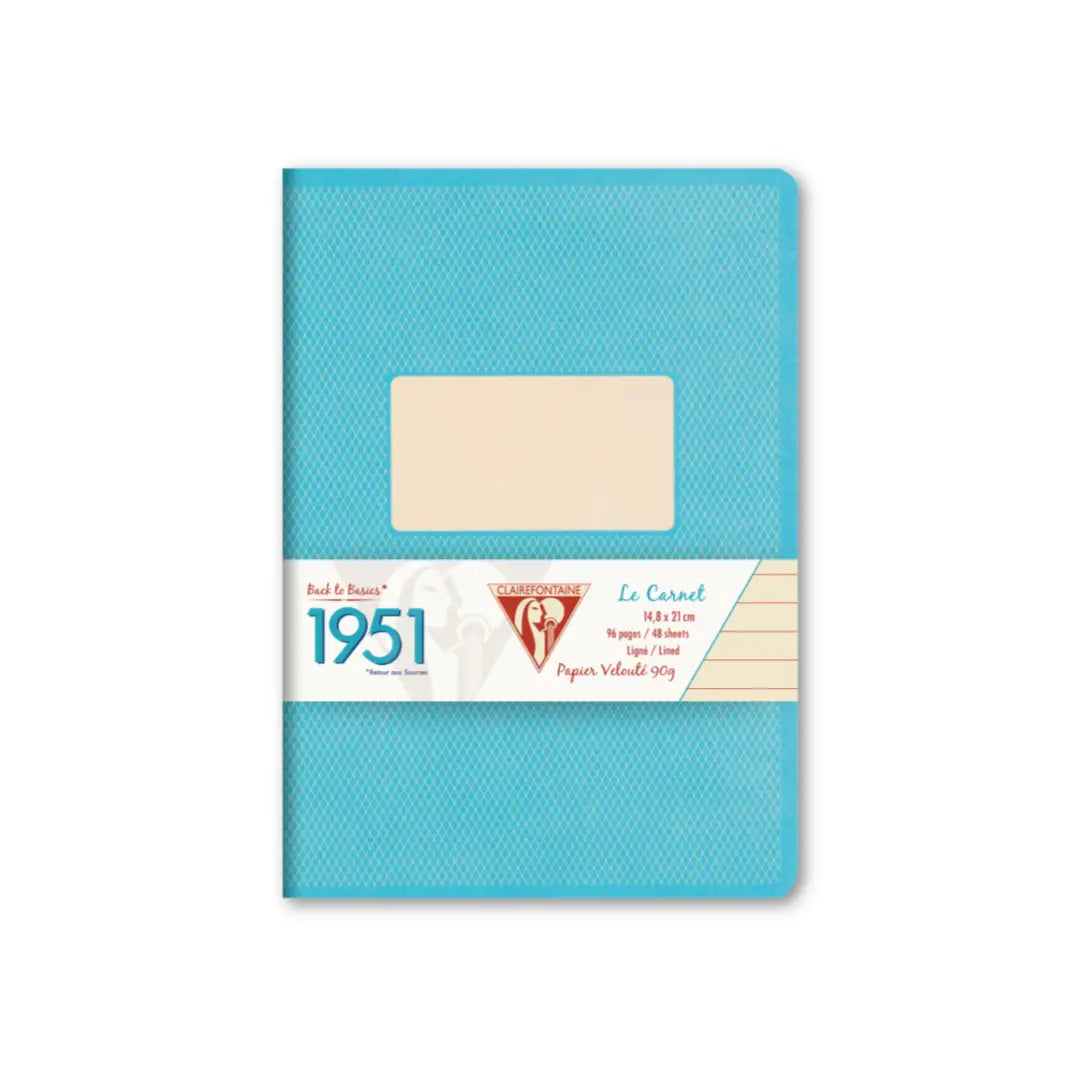 A vintage 1951 French pocket calendar, Le Carret, in a textured turquoise blue cover with a central cream-colored label window and a white paper band around the middle.